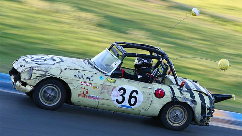 a car modded to look like a bumble bee on a 24 Hours of Lemons course