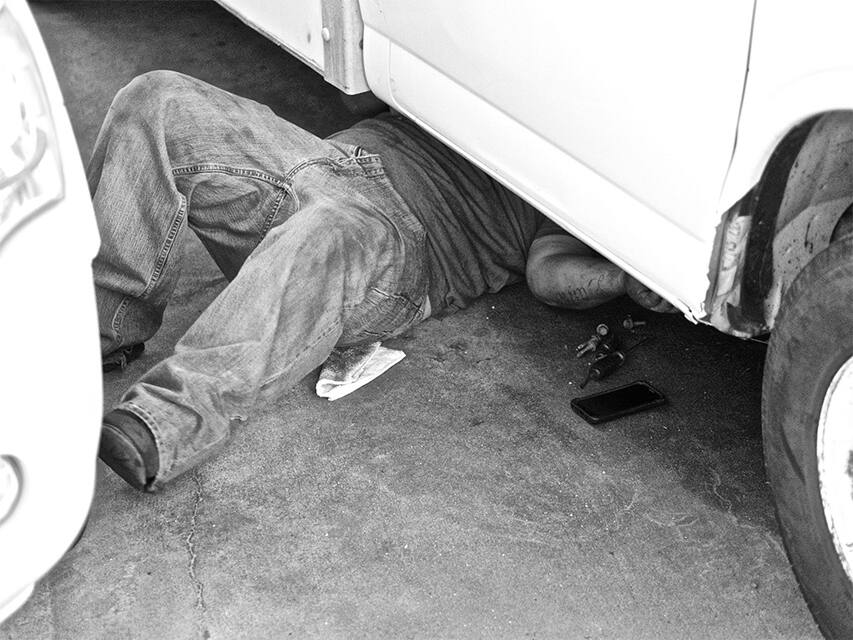 mechanic under a car