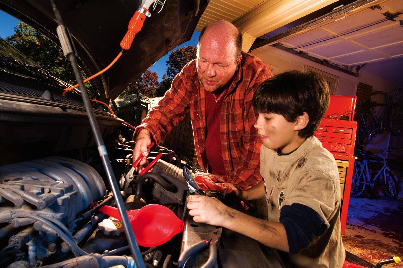 father son work under hood