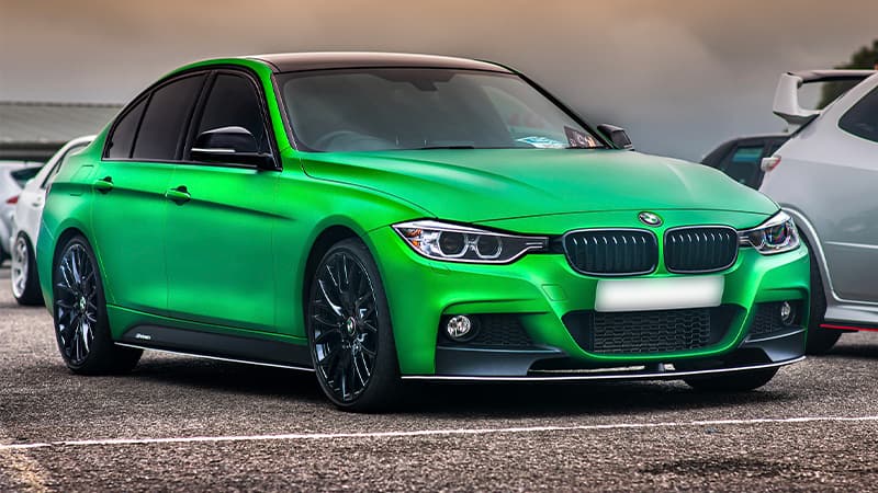 bright green metallic wrapped vehicle with tinted windows and black wheels